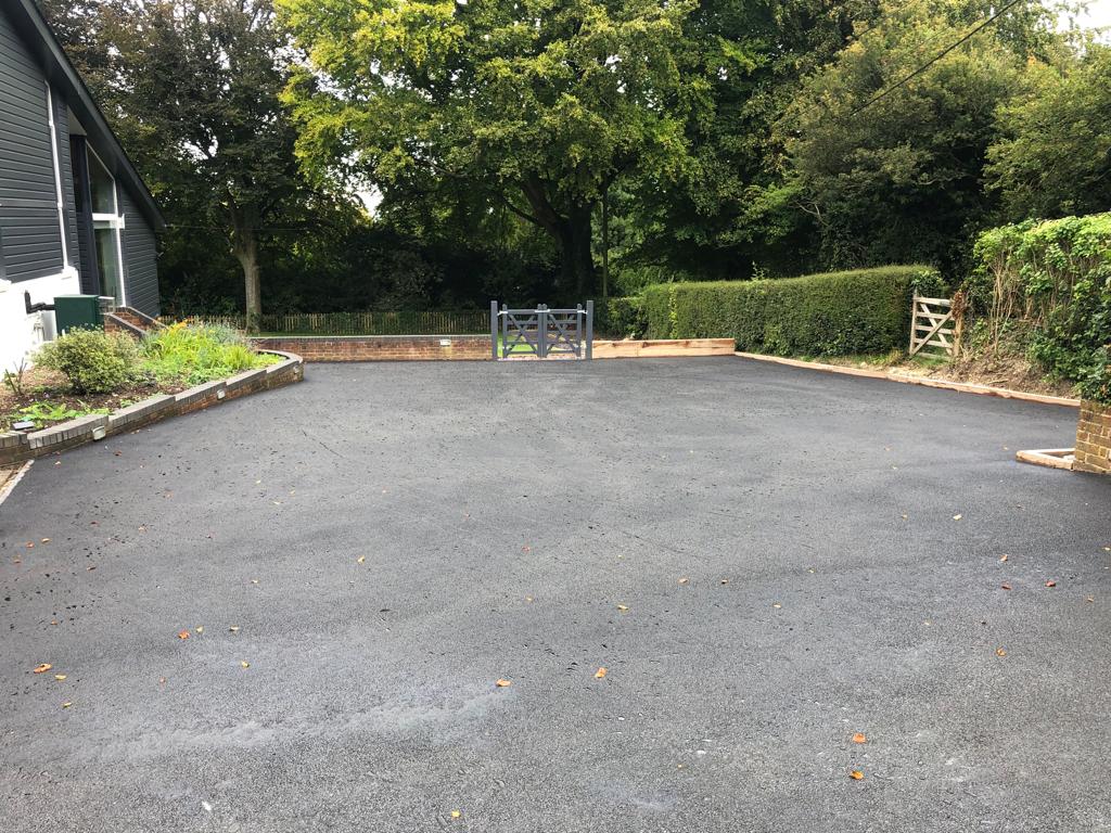 This is a photo of a bitumen driveway which is in the process of being installed by Canungra Asphalt & Bitumen Surfacing